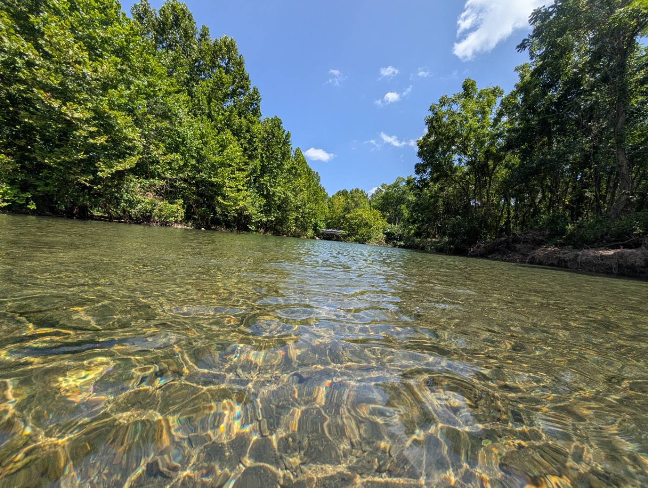 Wide view of Five Mile Creek reflecting the sky
